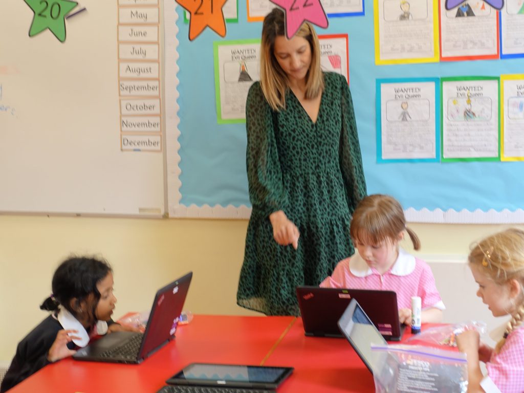 teacher in the class with children