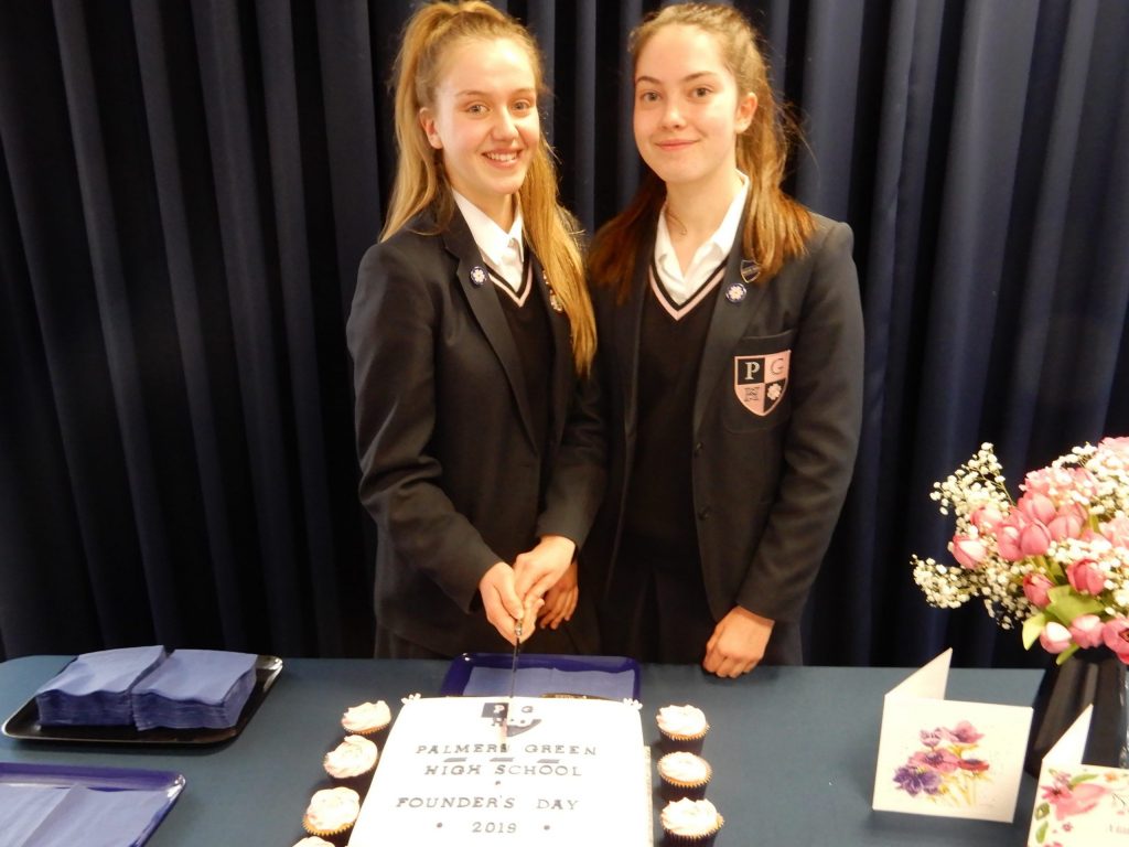 Students cutting a cake