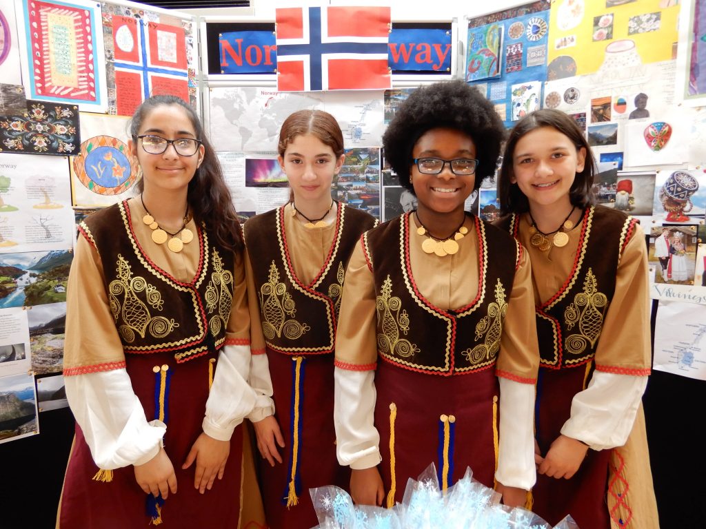 students in traditional wear
