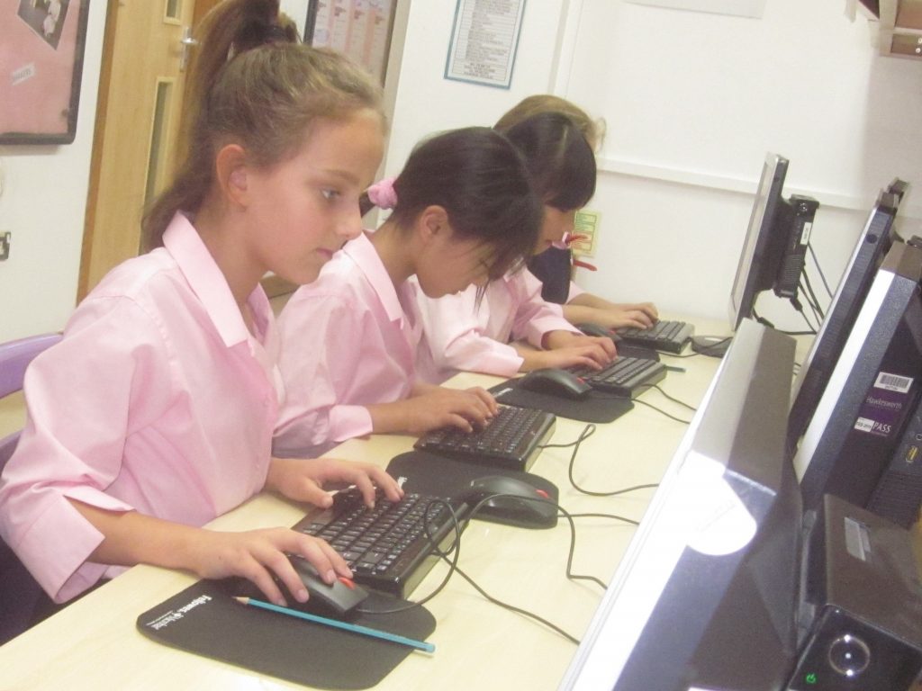 students working in the computer room