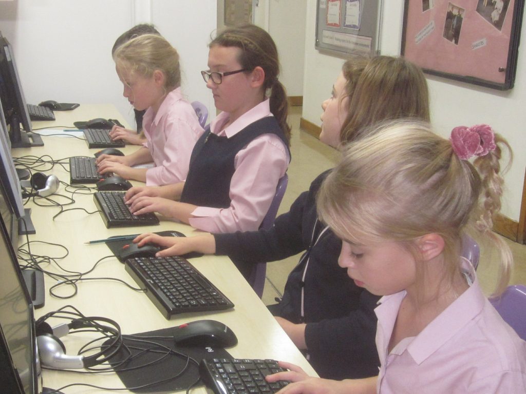 students working in the computer room