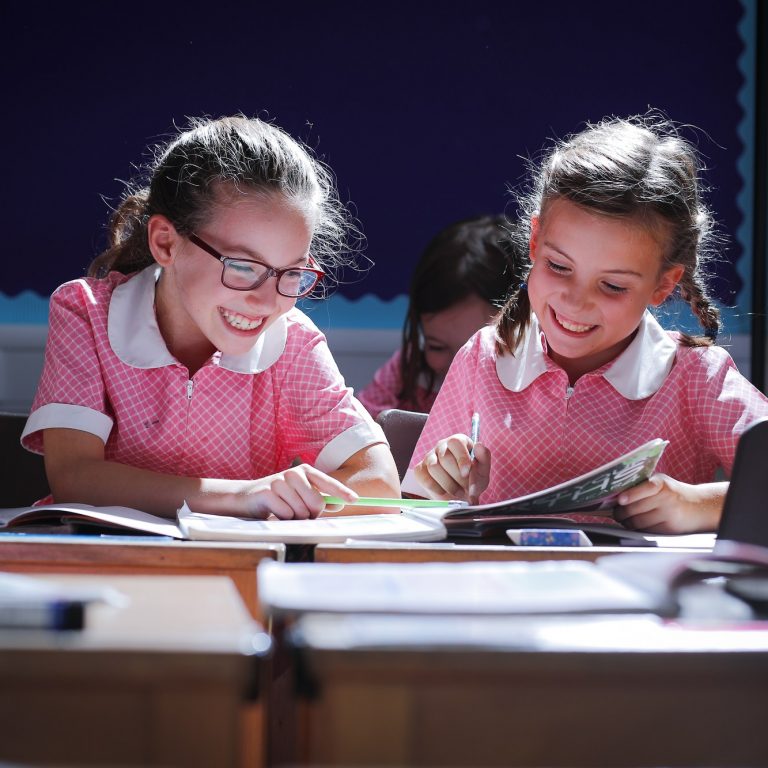 girls smiling in class