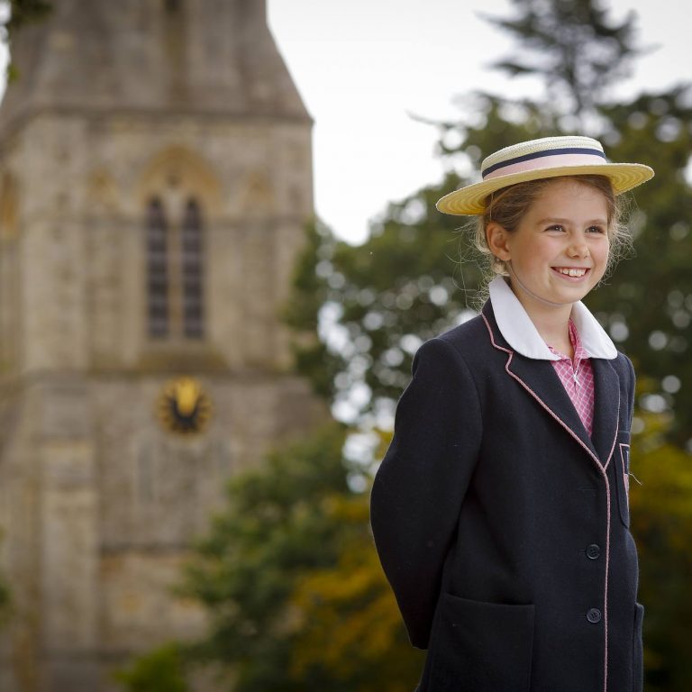 girl wearing her school uniform