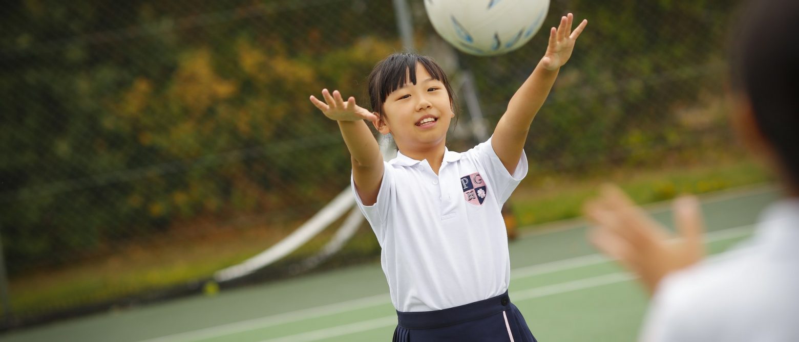 girl throwing a ball