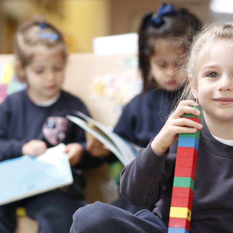 girl stacking blocks