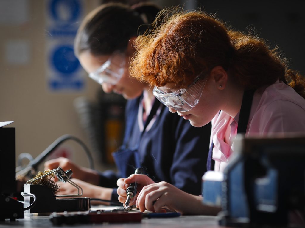 students using soldering irons