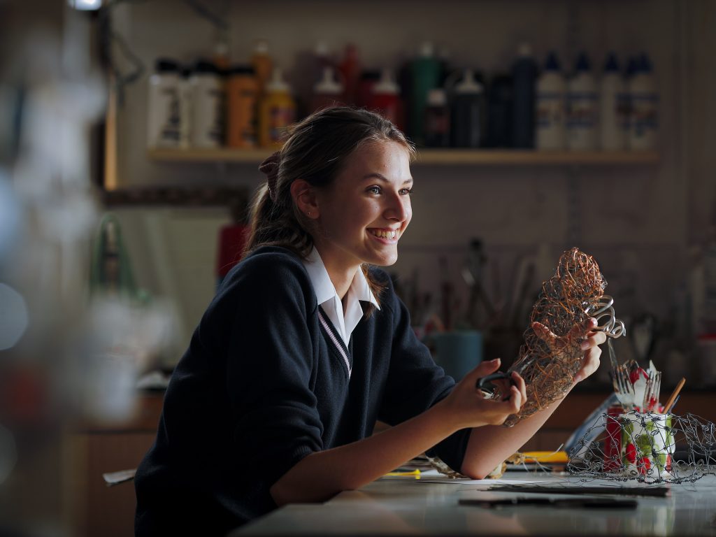 student working with wire