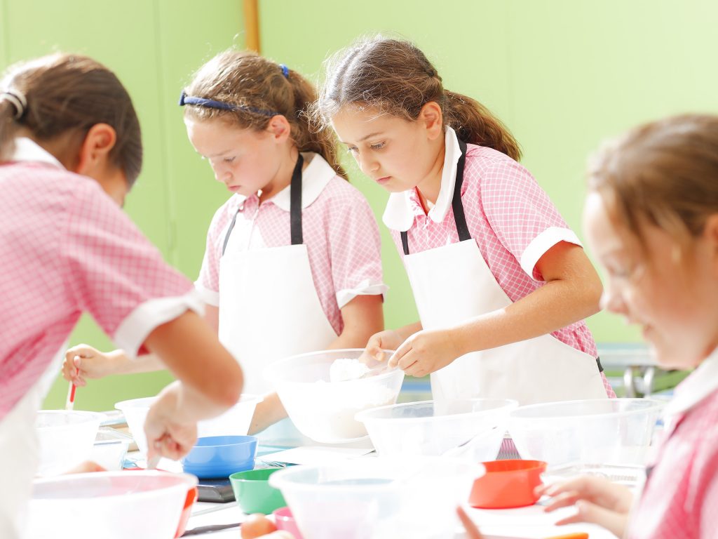 students adding ingredients