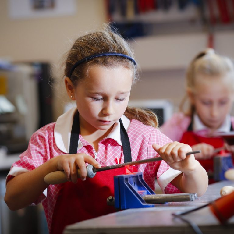 young student in woodwork class