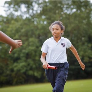 student holding a baton