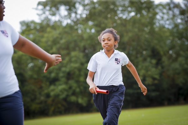 student holding a baton