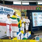 students with their karate championship winnings