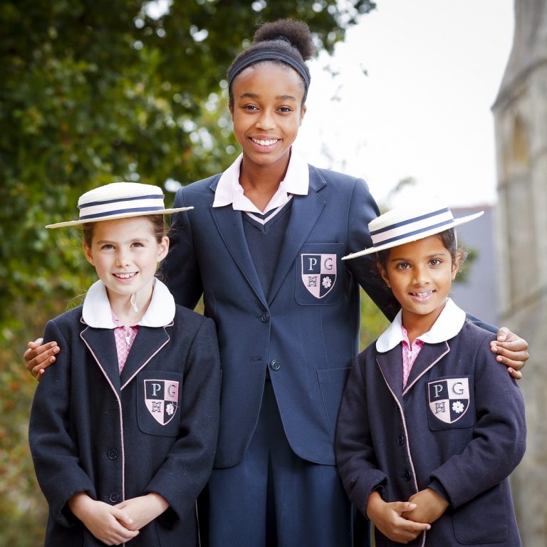 Students standing by each other for a bright and happy photo for a homepage banner