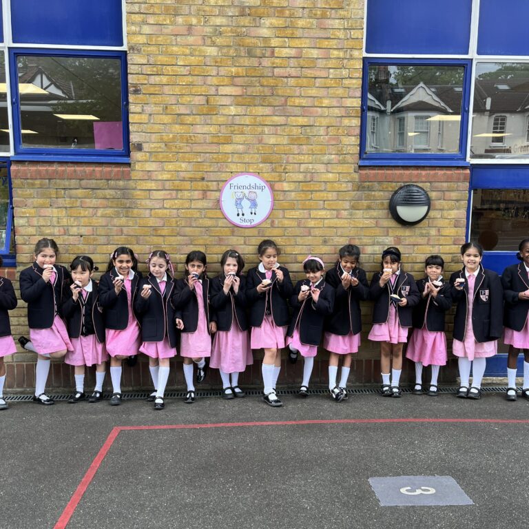 Students standing by a wall