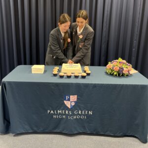 Students cutting a cake