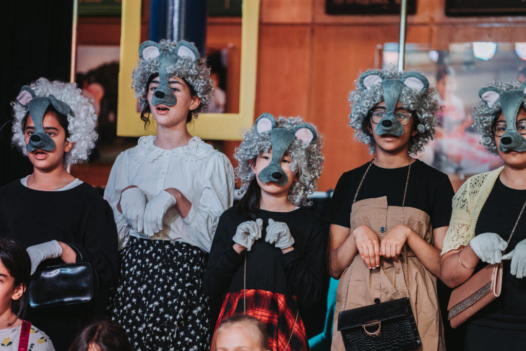 students wearing mouse costumes