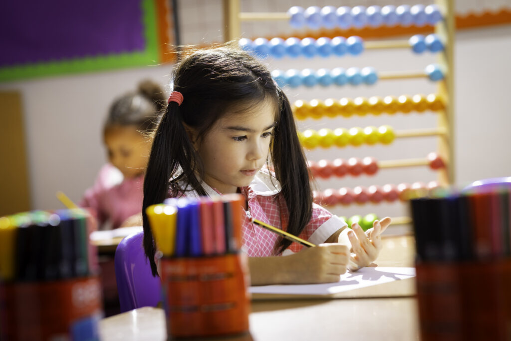 student counting with her fingers