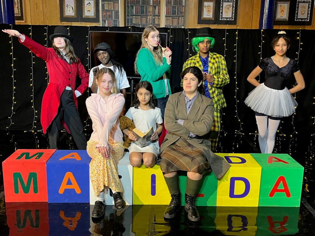 students in a drama production