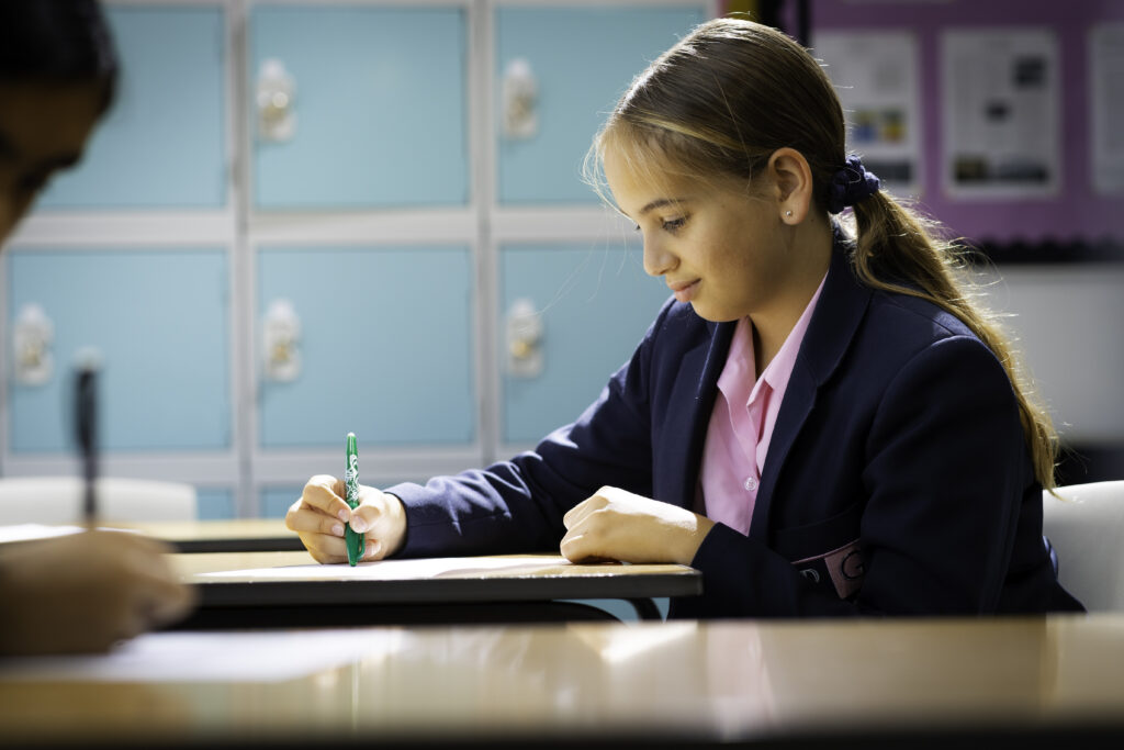 girl writing in class