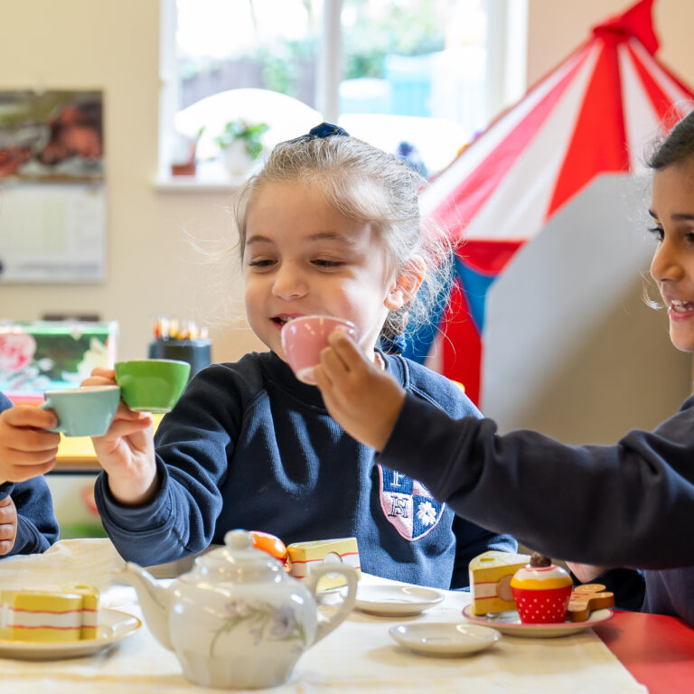 nursery girls enjoying tea